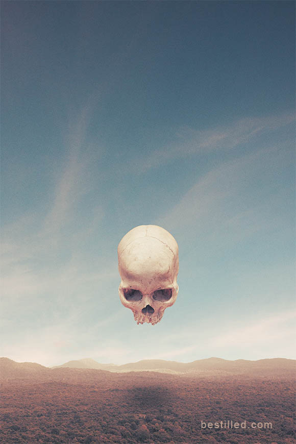 Giant skull hovering over Sri Lankan landscape, surreal artwork by Joseph Westrupp.