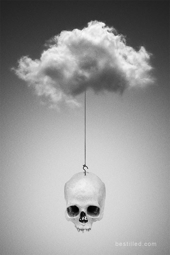 Skull hanging from a cloud by string. Surreal art photograph by Joseph Westrupp.