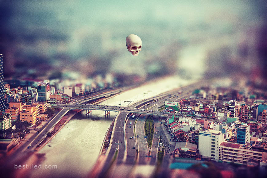 Skull floating over Ho Chi Minh City, Vietnam, surreal artwork by Joseph Westrupp.