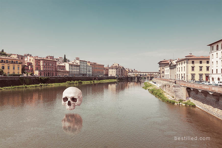 Skull hovering over the Arno river in Florence, Italy. Surreal art photo by Joseph Westrupp.