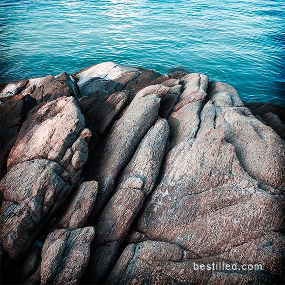 Art photo of rocks and ocean on the shoreline of Ko Samet, Thailand. By Joseph Westrupp.