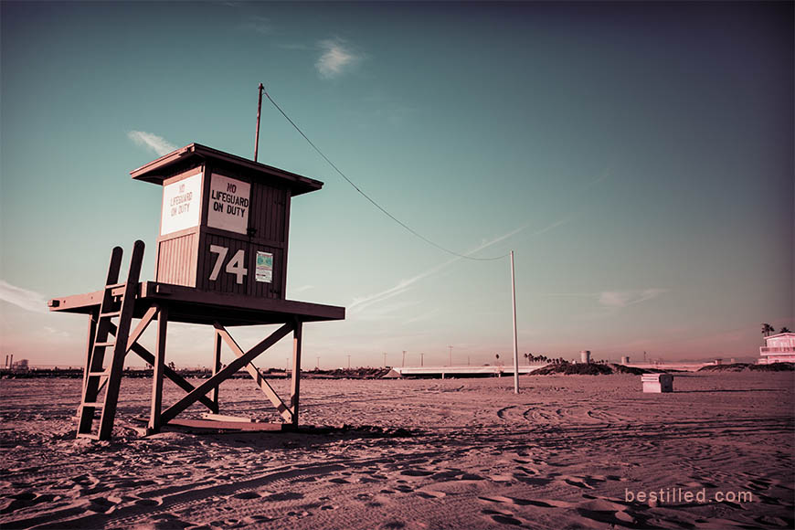 Lifesaver hut on the beach at sunset, Pacific Coast Highway in LA, California. Art photo by Joseph Westrupp.