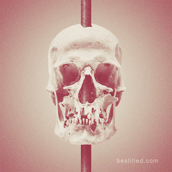 Skull impaled on pole, surreal sepia and red art photo by Joseph Westrupp.