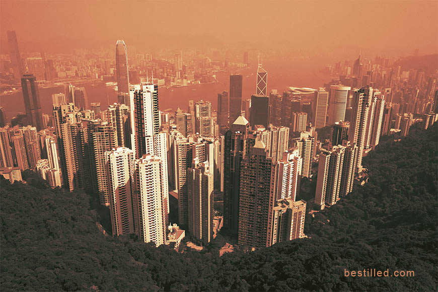 Cityscape of Hong Kong in orange and green, art photo by Joseph Westrupp.