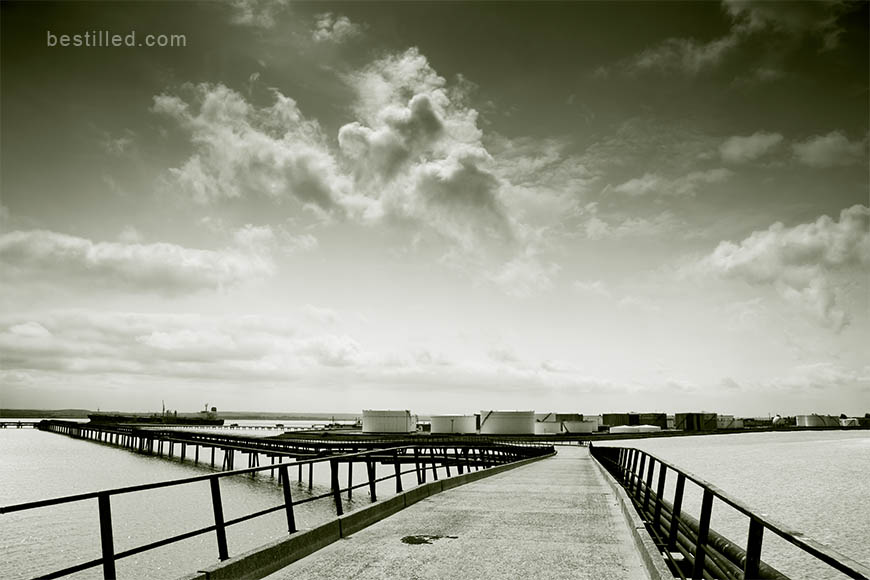 Occidental Jetty over the Thames, Canvey Island, England. Green monochrome art photo by Joseph Westrupp.