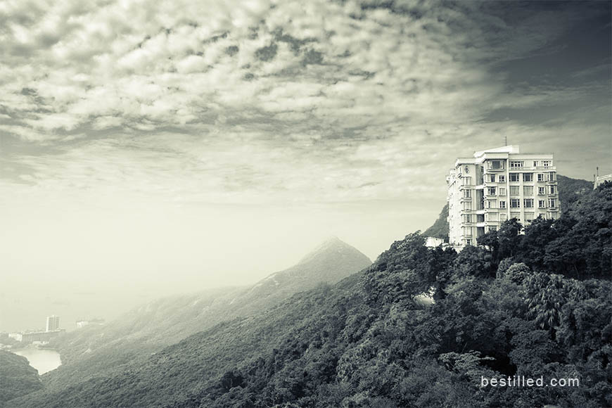 Art photograph of hills, ocean, and buildings from Victoria Peak, Hong Kong, by Joseph Westrupp.