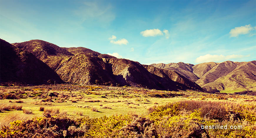 Art photograph of fields, hills, and sky in Wainuiomata, New Zealand. By Joseph Westrupp.